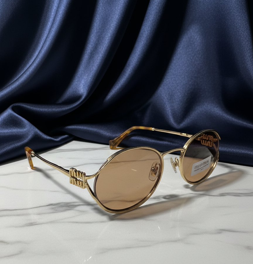 Miu Miu SMU52Y – Oval Gold Metal Sunglasses with Pale Gold Lenses